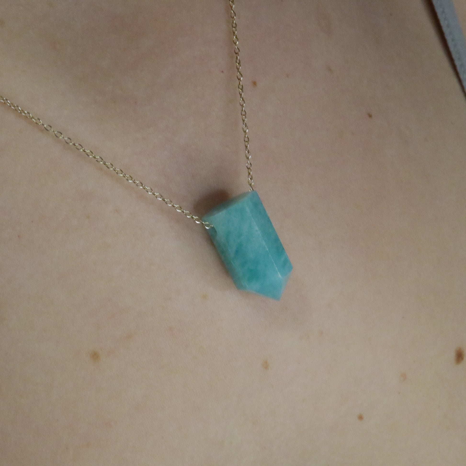 Girl wearing Amazonite crystal necklace