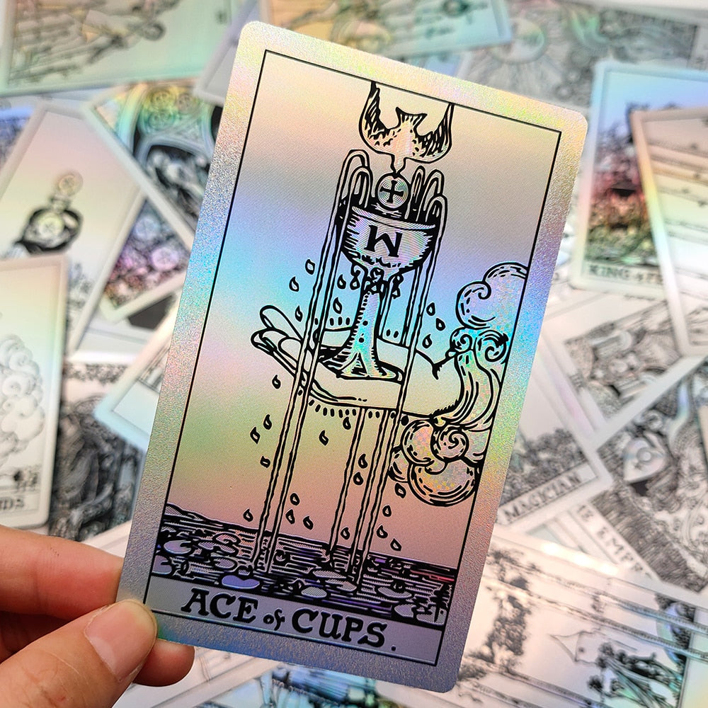 Tarot card held up showing that its iridescent