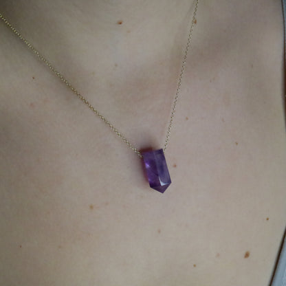 Girl wearing Amethyst crystal necklace