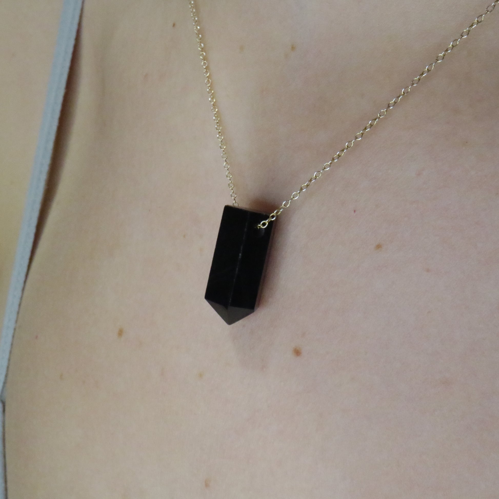Girl wearing Black Onyx crystal necklace
