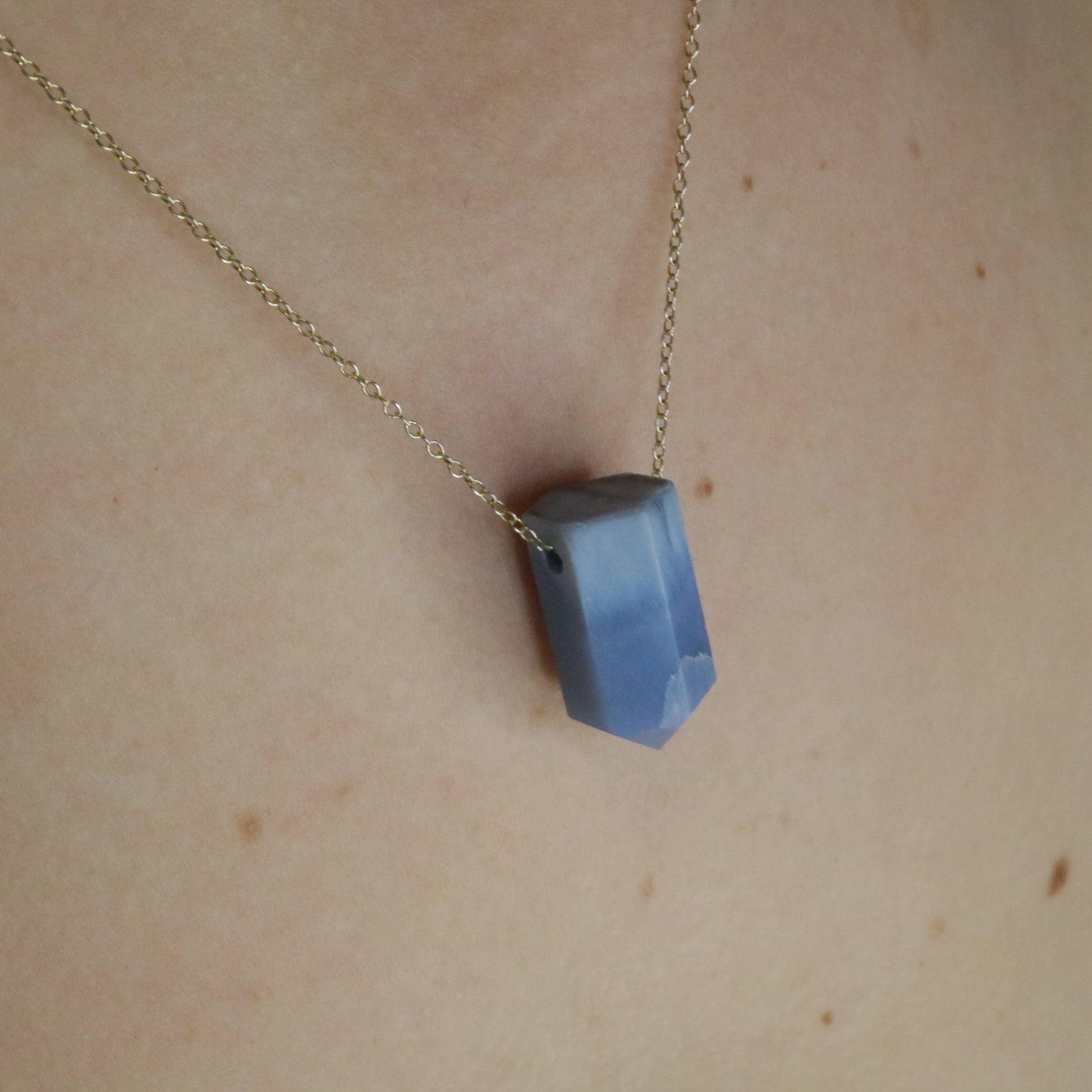 Girl wearing Blue Opal crystal necklace