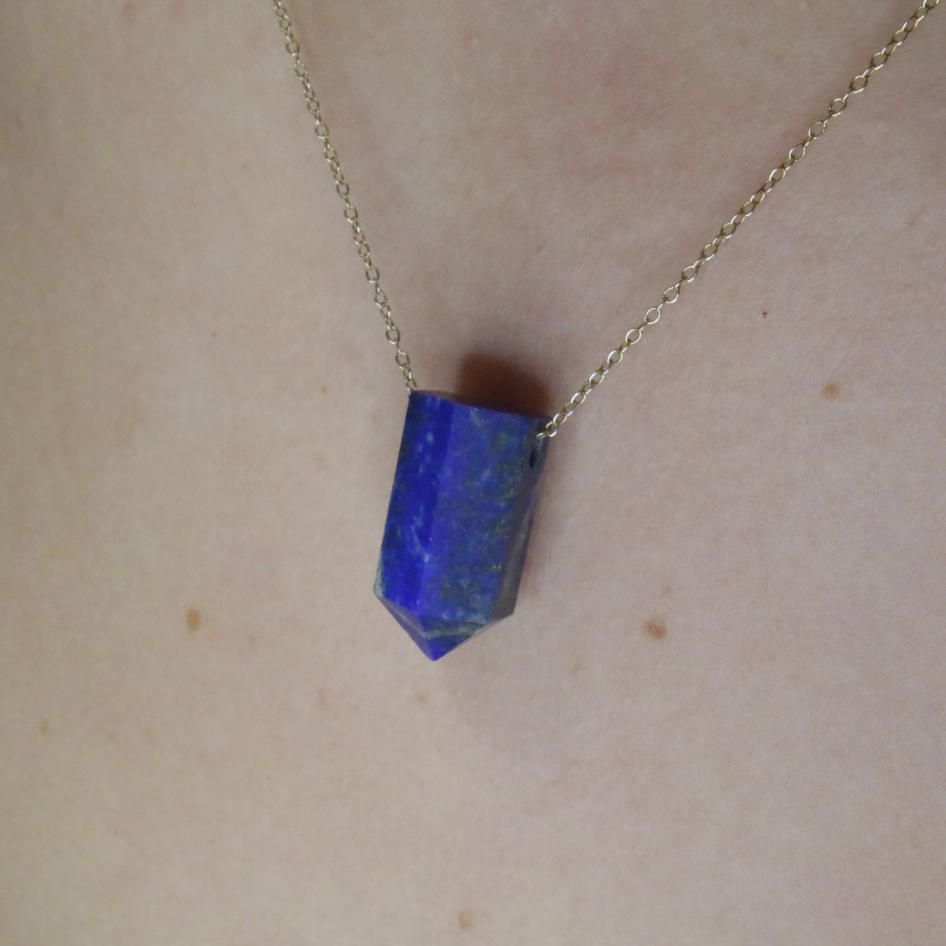 Girl wearing Lapis Lazuli crystal necklace