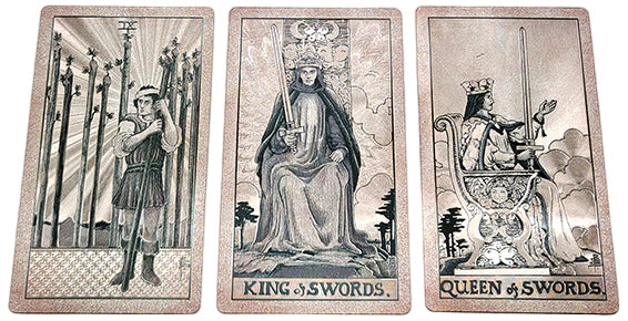 Three tarot cards displaying the front face for the pink and blue design showing the design