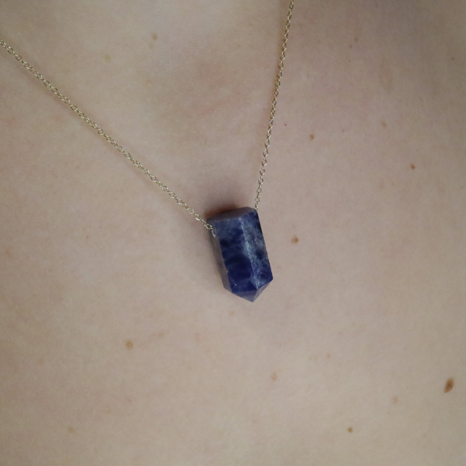 Girl wearing Sodalite crystal necklace