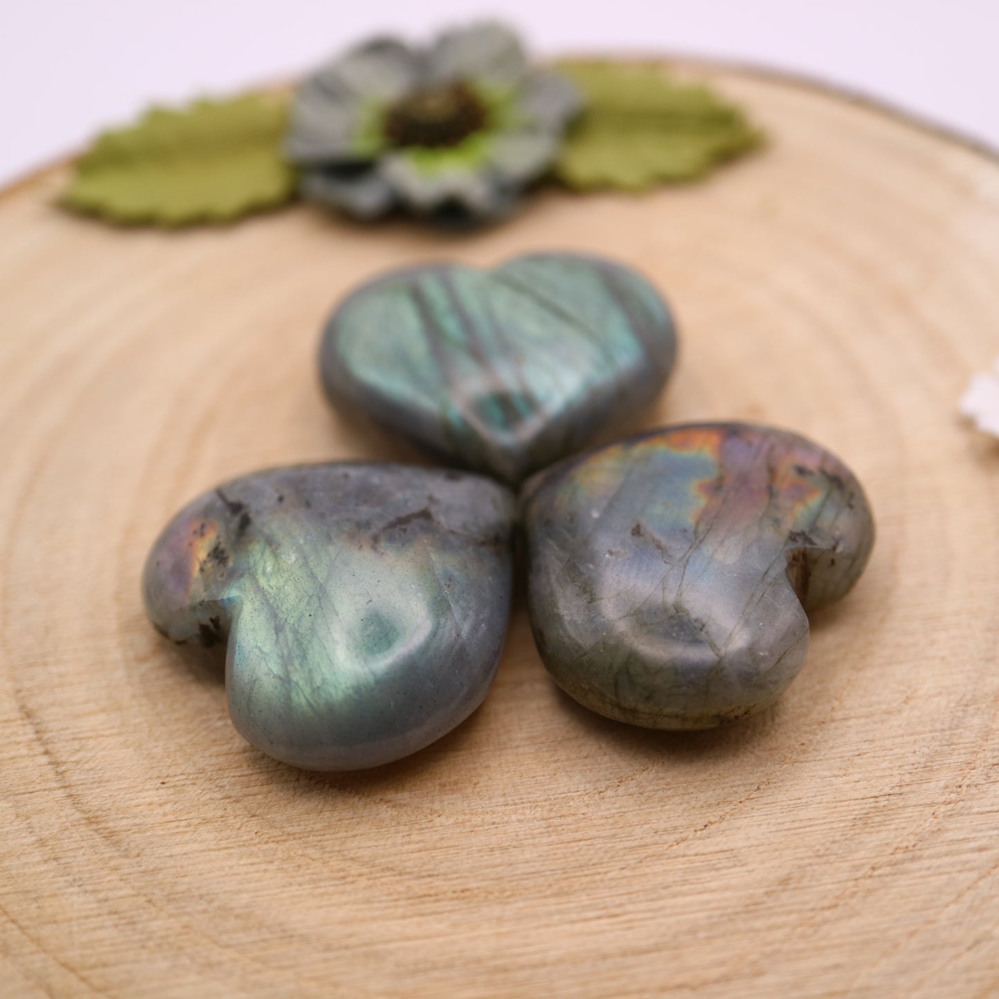 Three pieces of Labradorite crystal in the shape of a heart put together